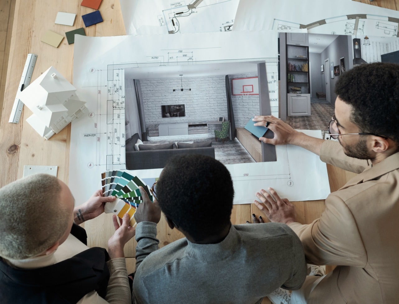 Interior design team reviewing concepts and material selections for future-focused interior projects